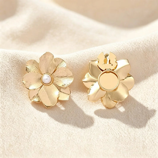 Light luxury textured gold floral button cover featuring a central white pearl. Set against a clean cream white background, the right piece displays the open clip mechanism, showcasing a realistically scaled faux cufflink for everyday elegance.