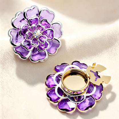 Brilliant amethyst purple layered crystal floral button cover featuring silver-toned edges and a central rhinestone. Includes a detailed view of the silver open clasp mechanism on a soft cream background.