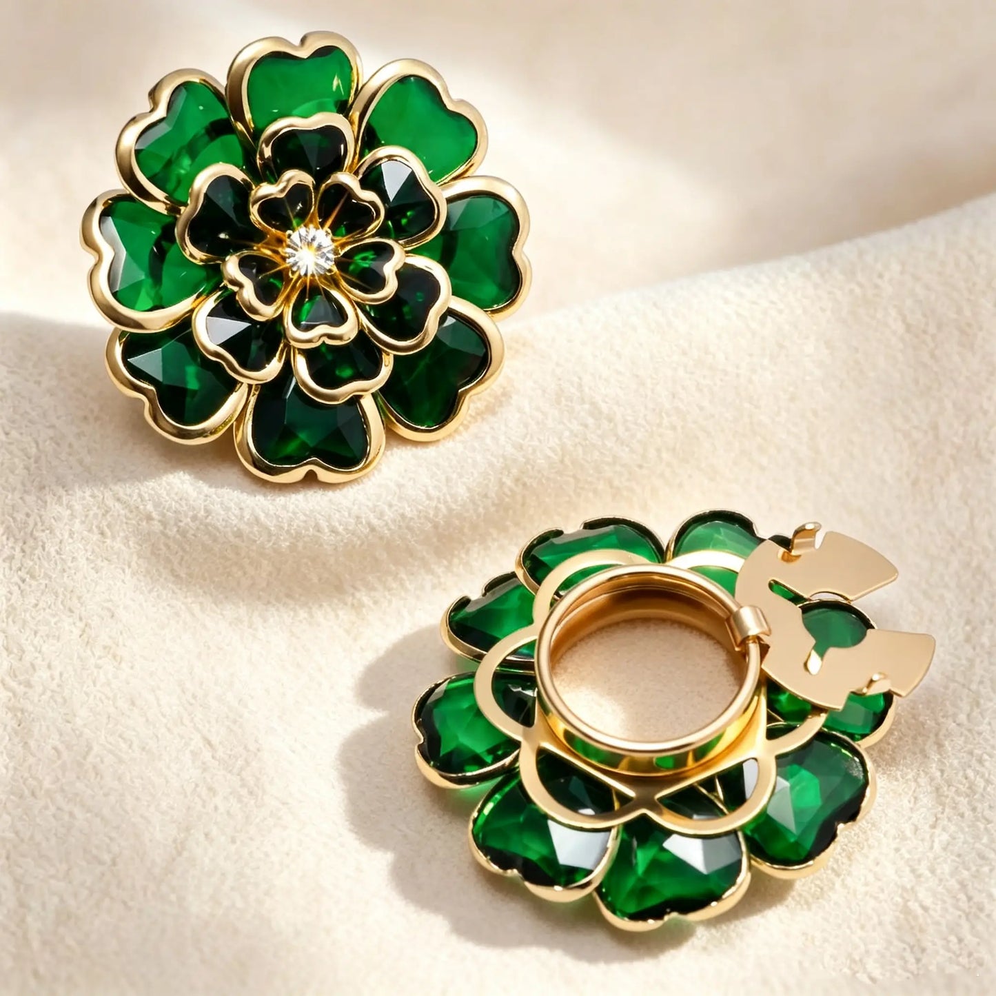 Luxurious emerald green layered glass floral button cover with a stained glass effect and gold borders. Displays the open gold clip mechanism, functioning beautifully as a faux cufflink.