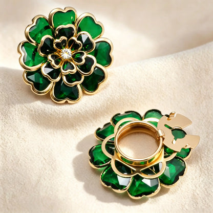 Luxurious emerald green layered glass floral button cover with a stained glass effect and gold borders. Displays the open gold clip mechanism, functioning beautifully as a faux cufflink.