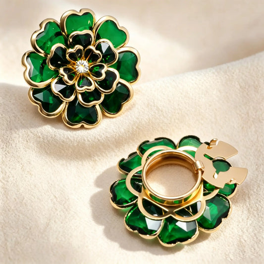 Luxurious emerald green layered glass floral button cover with a stained glass effect and gold borders. Displays the open gold clip mechanism, functioning beautifully as a faux cufflink.
