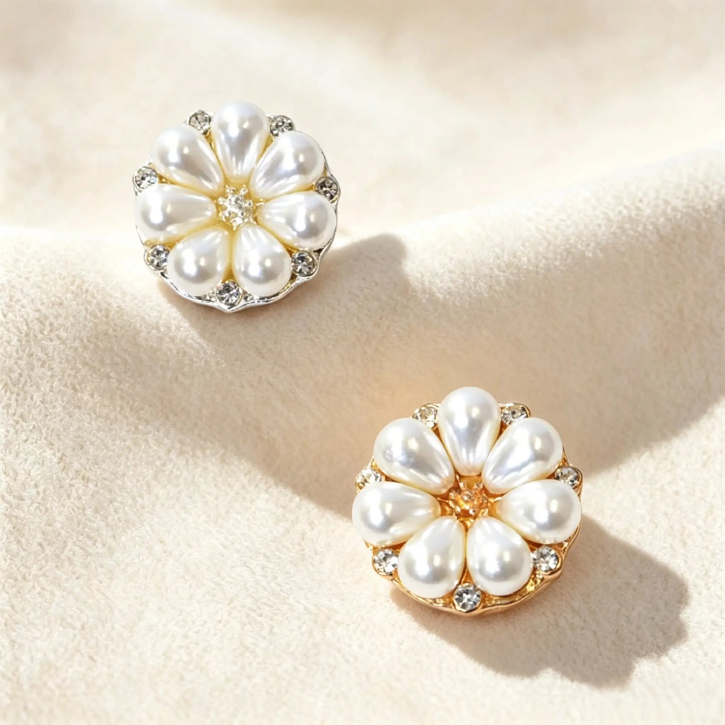 A pair of elegant floral pearl button covers in gold and silver tones, a perfect no-sew jewelry accessory for wardrobe renewal and shirt styling