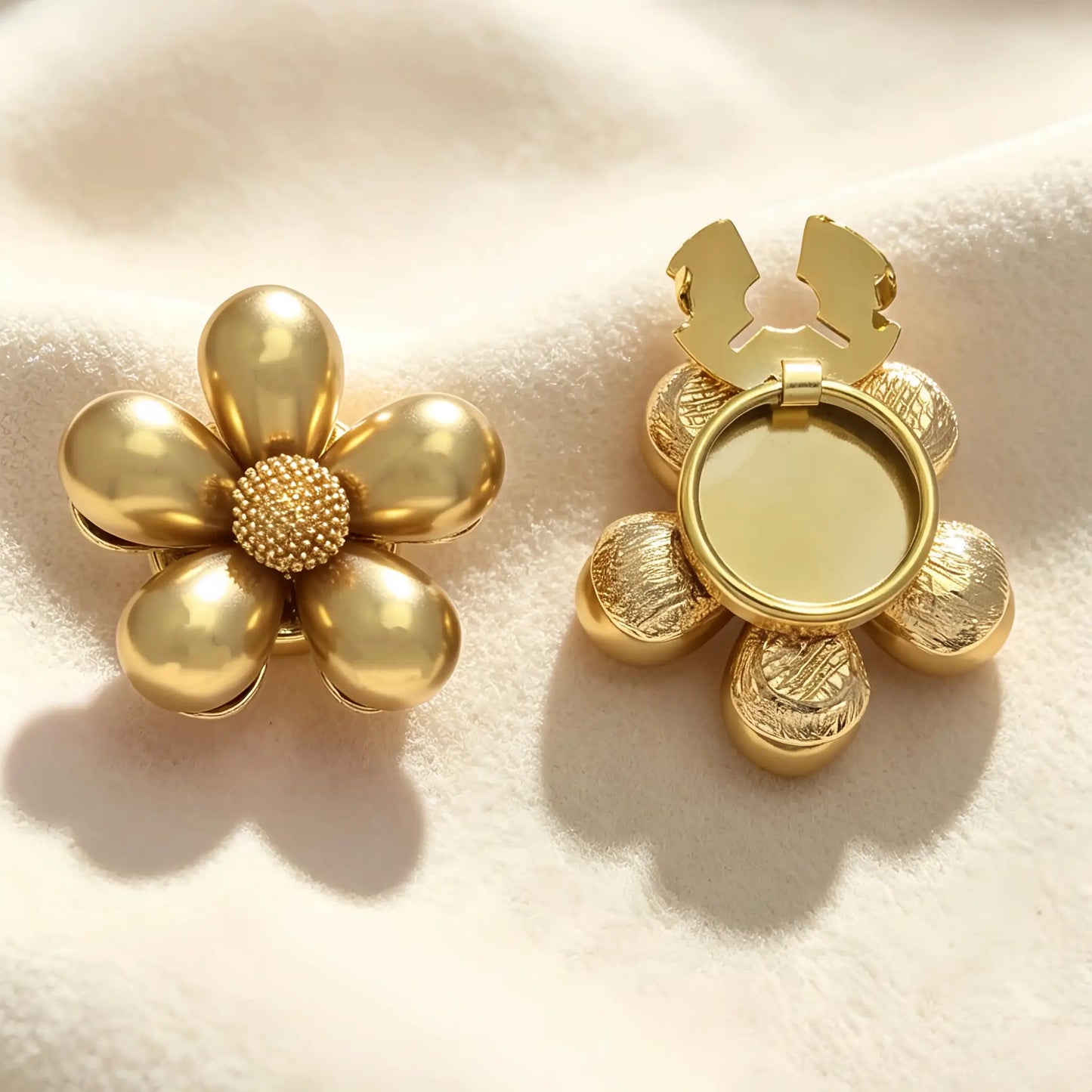 Glossy gold floral button cover with a textured gold core. The image highlights the open back clasp mechanism, demonstrating how it easily snaps onto shirt cuffs for a French-style finish without sewing.