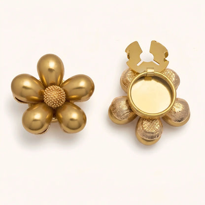 Glossy gold floral button cover with a textured gold core. The image highlights the open back clasp mechanism, demonstrating how it easily snaps onto shirt cuffs for a French-style finish without sewing.