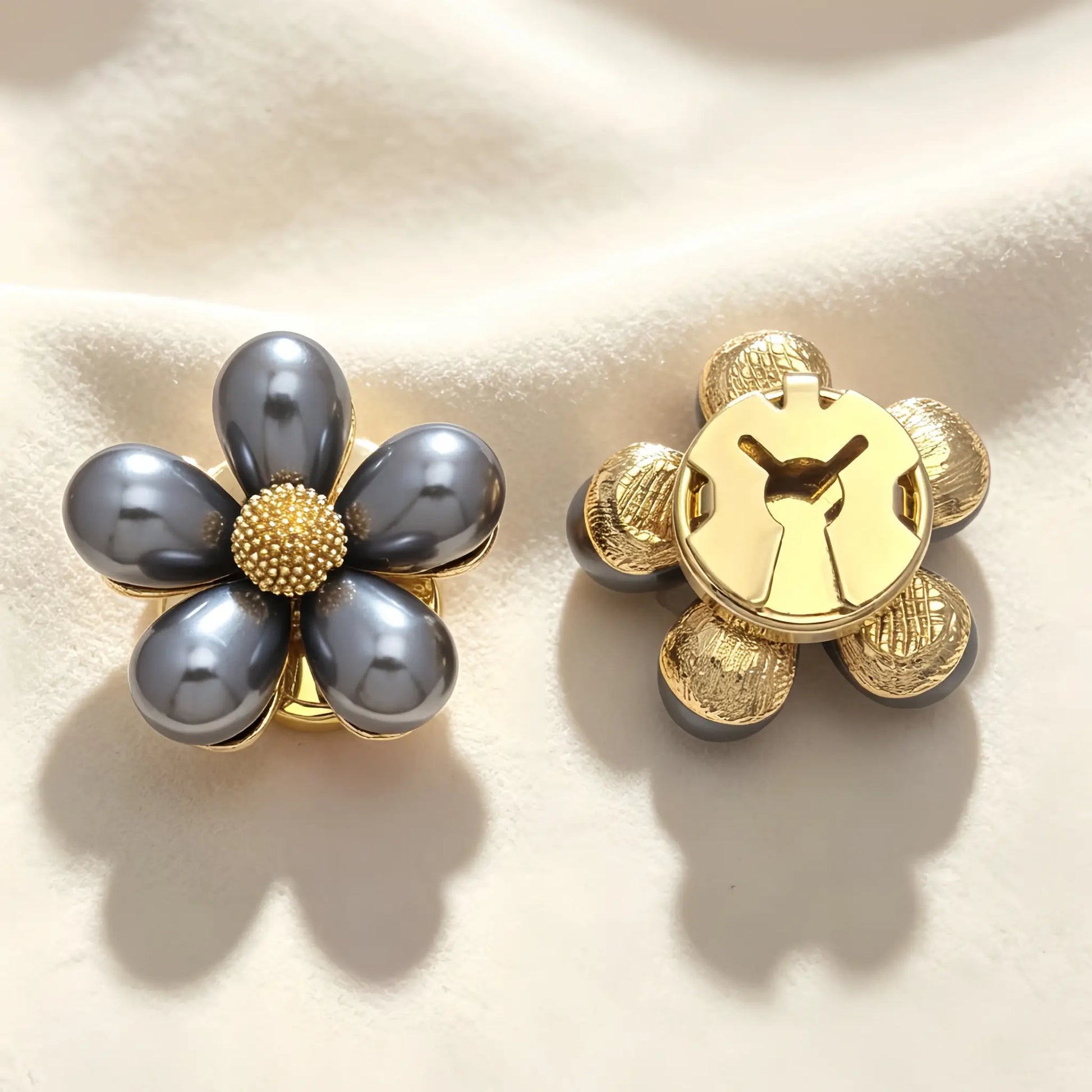 Light luxury gold metallic floral button cover featuring teardrop petals and a textured center. The right piece displays the secure closed gold clip, perfect for instantly upgrading standard shirt cuffs.