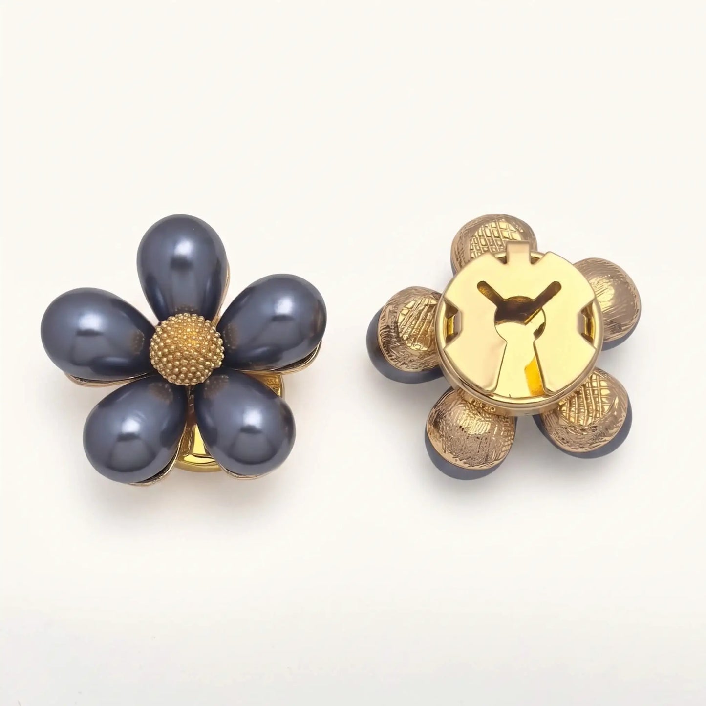 Light luxury gold metallic floral button cover featuring teardrop petals and a textured center. The right piece displays the secure closed gold clip, perfect for instantly upgrading standard shirt cuffs.