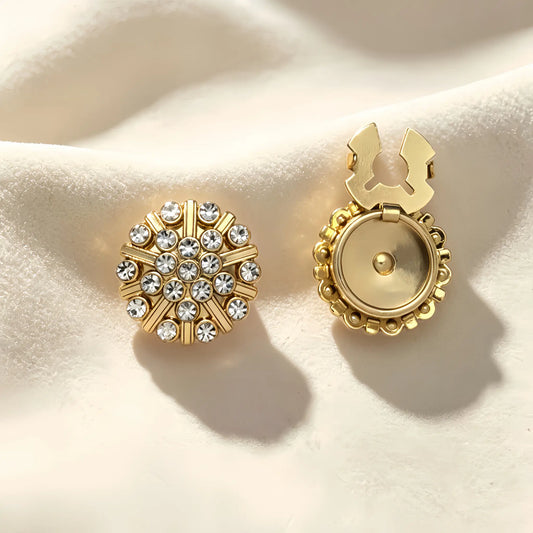 Elegant round gold medallion button cover featuring concentric circles of sparkling rhinestones. Shown with the gold attachment clip fully open, demonstrating an effortless and brilliant faux cufflink solution.