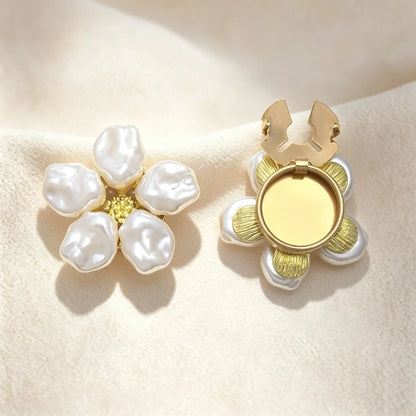 Detailed view of a light luxury baroque pearl floral button cover. The right piece demonstrates the open gold hinge mechanism, showing how easily it snaps onto standard shirt buttons for a seamless, no-sew cuff upgrade.