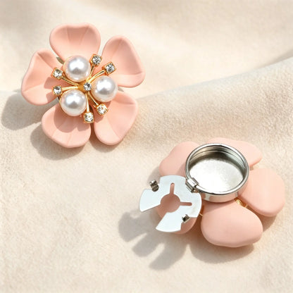 Light luxury matte blush pink floral button cover centered with three white pearls and rhinestones. Displays the open silver clasp mechanism, perfect for an elegant, no-sew faux cufflink upgrade.