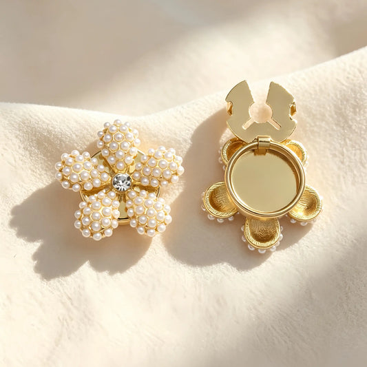 Light luxury five-petal floral button cover beautifully crafted from clustered white pearls with a central rhinestone. The right piece shows the open gold clasp mechanism, perfect for a no-sew faux cufflink upgrade.