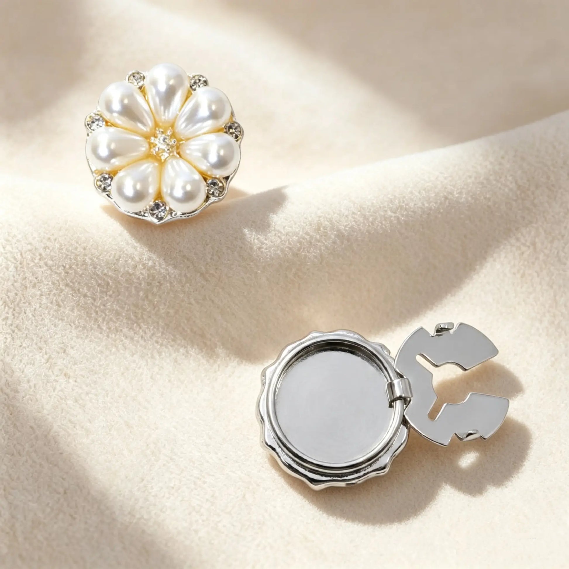 Silver pearl flower button cover with a functional hinge design, providing a sophisticated French style accent to standard shirt buttons.