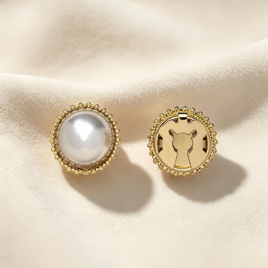 Elegant minimalist round button cover featuring a single large white pearl surrounded by a delicate vintage gold beaded edge. The right piece shows the secure closed gold backing, resting on soft cream fabric. Perfect as a classic faux cufflink.