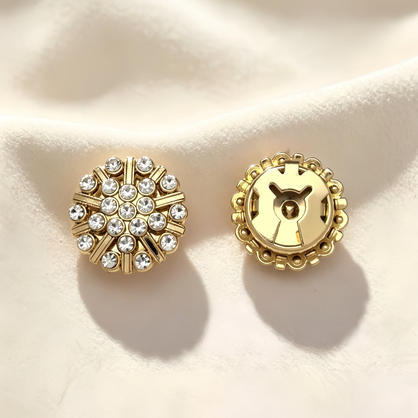 pair of light luxury vintage gold and rhinestone button covers. The image highlights the closed gold clip mechanism on the back, offering a refined, heavy-craftsmanship cuff upgrade under warm sunlight.