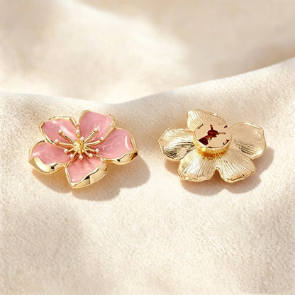 Close-up of a pair of vintage-style pink enamel button covers. The image highlights the beautiful textured gold back and the securely closed clip, ensuring the faux cufflink lays perfectly flat on standard shirt buttons without adding bulk.