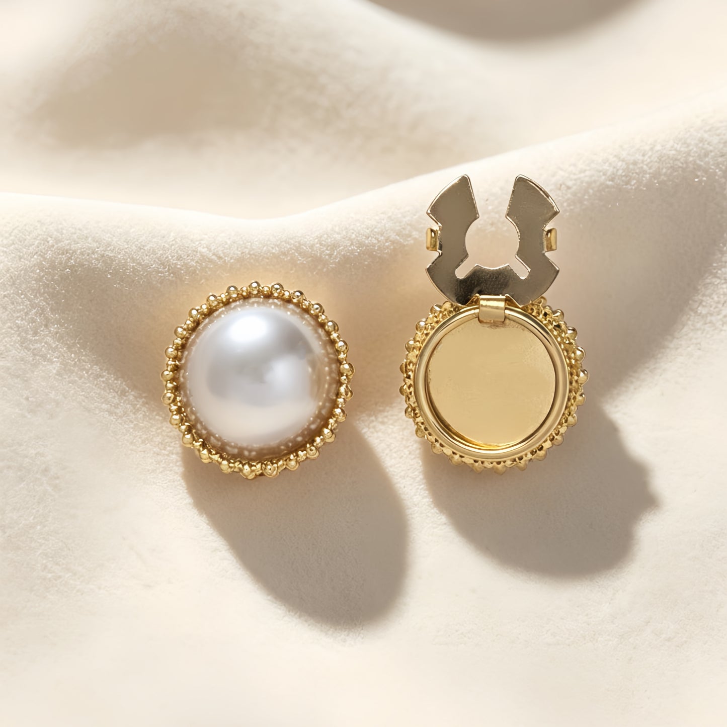 Detailed view of a light luxury round pearl button cover with a vintage gold milgrain border. The image highlights the open gold hinge mechanism, demonstrating a quick and effortless no-sew upgrade for standard shirt cuffs.