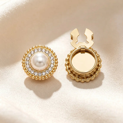 Vintage-style round button cover featuring a large central pearl surrounded by a halo of sparkling rhinestones and an outer border of mini pearls. The open gold hinge mechanism is displayed, offering a classic faux cufflink solution.