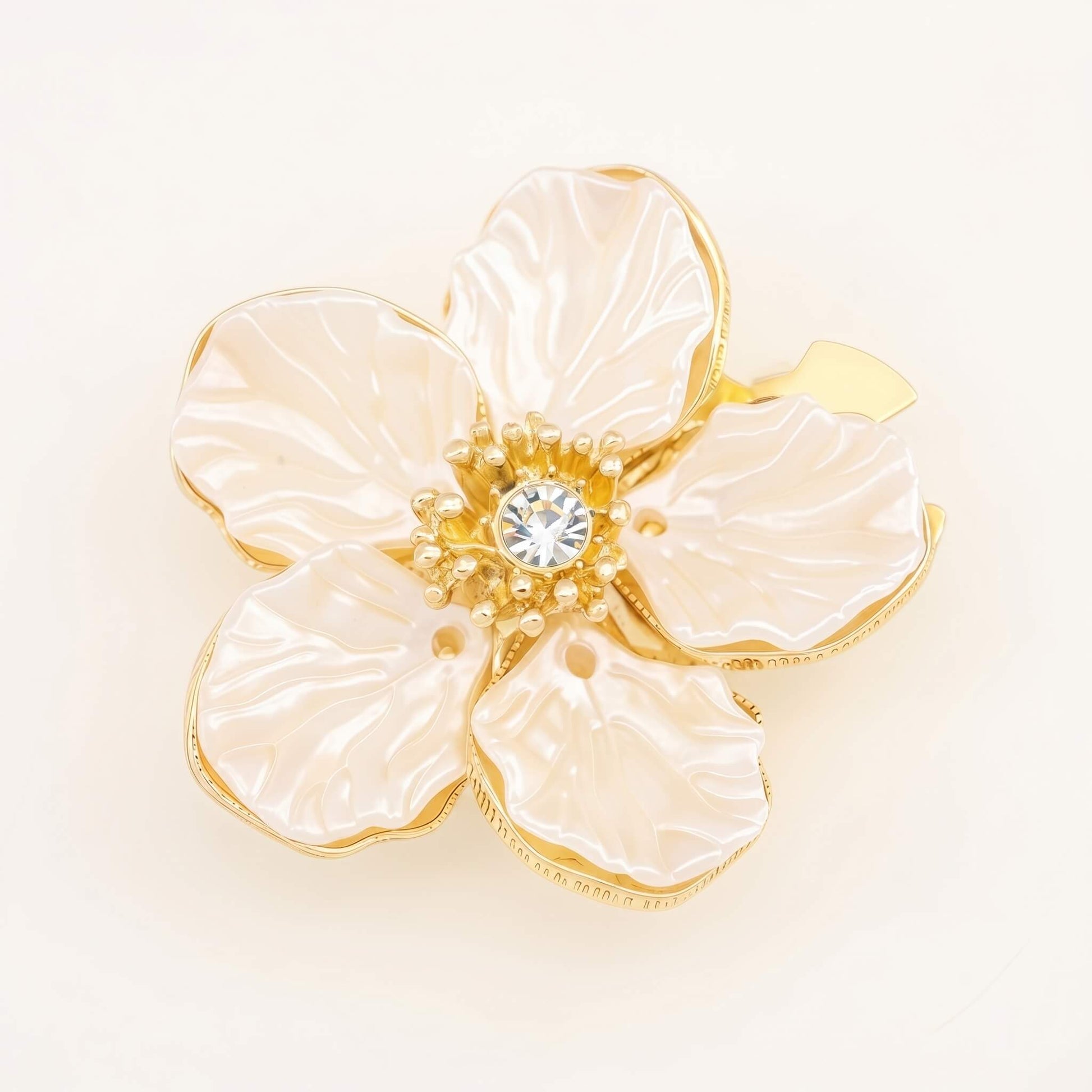 A premium white camellia button cover featuring imitation pearl petals and a 14K gold-plated frame with a shiny cubic zirconia center.