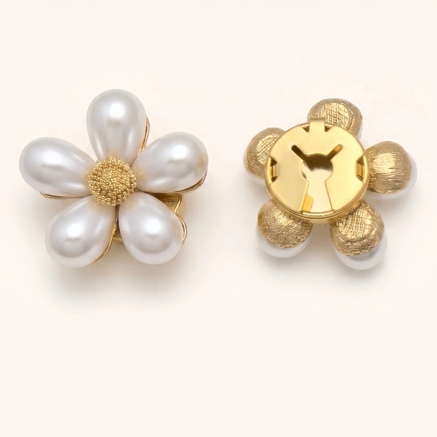 A pair of light luxury white pearl floral button covers on a minimalist background. The right piece illustrates the closed gold backing, ensuring a secure and elegant fit when used as a faux cufflink.